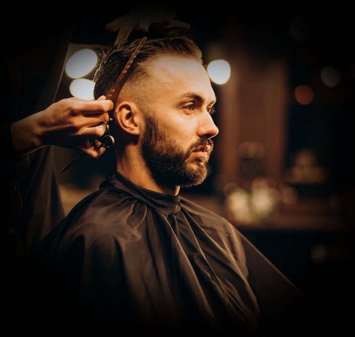 young man barbershop trimming hair